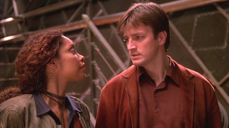 Zoe looking at Mal on Firefly