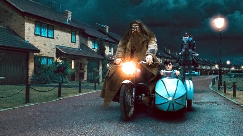 Hagrid driving his motorcycle with Harry in the sidecar on Privet Drive in Harry Potter and the Deathly Hallows Part 1