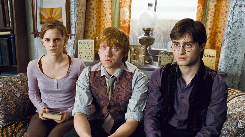 Hermione Harry and Ron looking shocked in Harry Potter and the Deathly Hallows Part 1