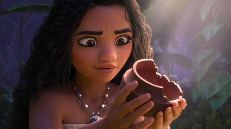 Auli'i Cravalho as Moana holding a broken pot in Moana 2