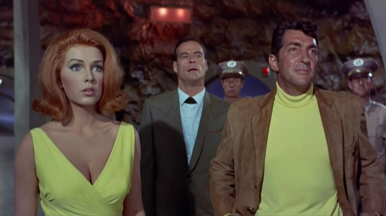 Gail standing next to Matt Helm with a guy in a suit behind them in The Silencers