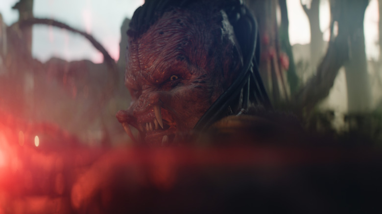 Dek pointing his weapon in Predator: Badlands