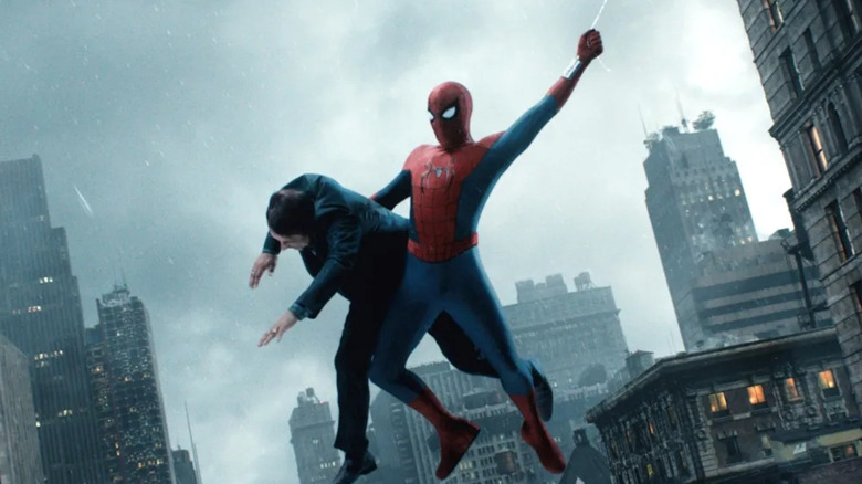 Spider-Man swings through the air holding a guy in Spider-Man: Brand New Day