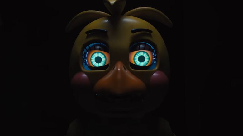 Chica staring out of the darkness in Five Nights at Freddy's 2