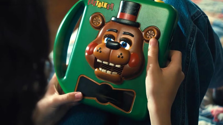 Abby holding the Faztalker in Five Nights at Freddy's 2