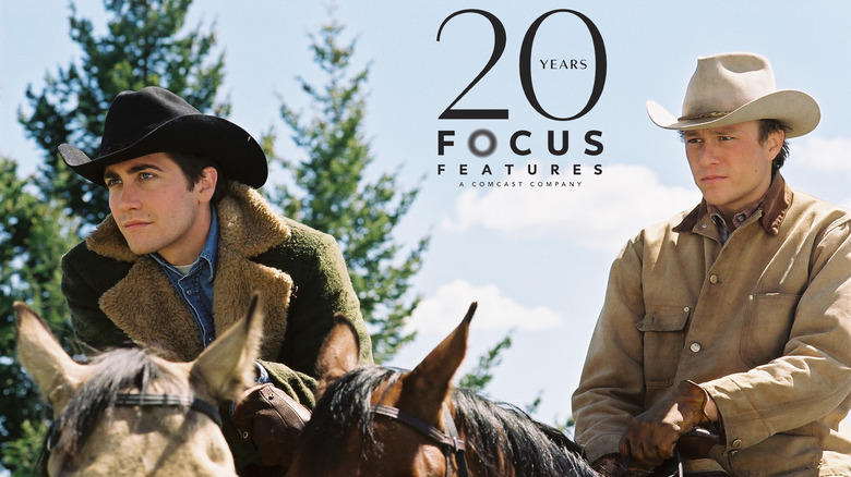 two men on horseback wearing cowboy hats