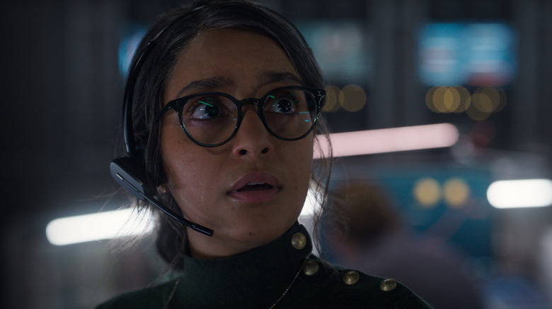 Aleida looks concern while she is in mission control helping a spaceship land on a moon of Jupiter in For All Mankind