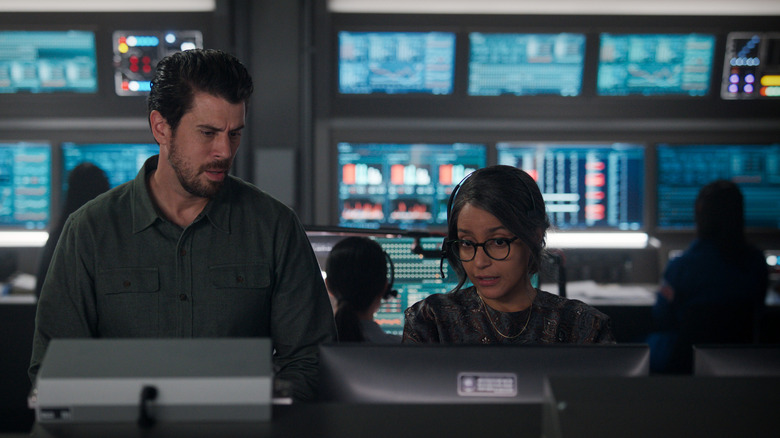 Aleida showing something on the control room screen to Miles in For All Mankind