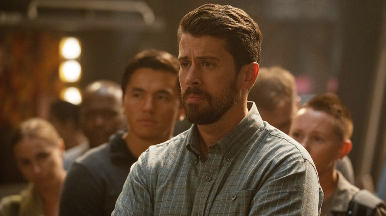 Miles Dale surrounded by disgrunted Martians in For All Mankind