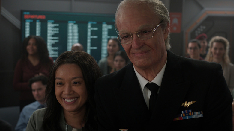 Ed and Kelly Baldwin smiling during a ceremony on Mars in For All Mankind