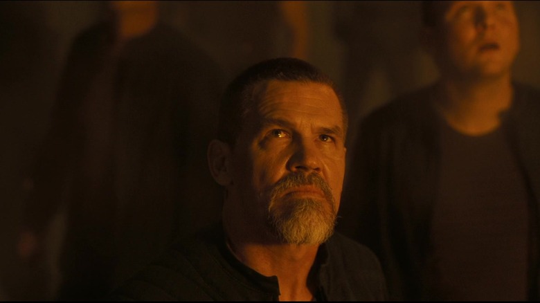 Gurney Halleck watching in horror as Harkonnen war ships land on Arrakeen in Dune: Part One
