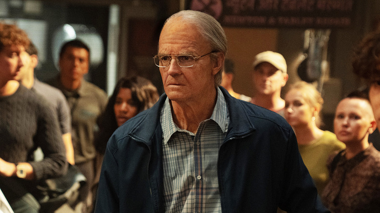 Joel Kinnaman's Edward Baldwin stands in a crowd in For All Mankind