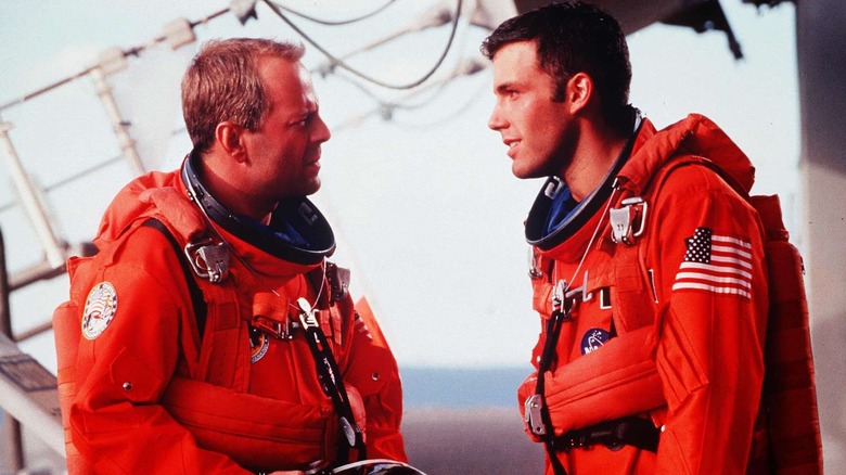 Harry and AJ arguing in space suits in Armageddon