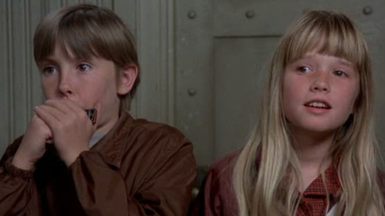 Tony and Tia looking at something in Escape to Witch Mountain