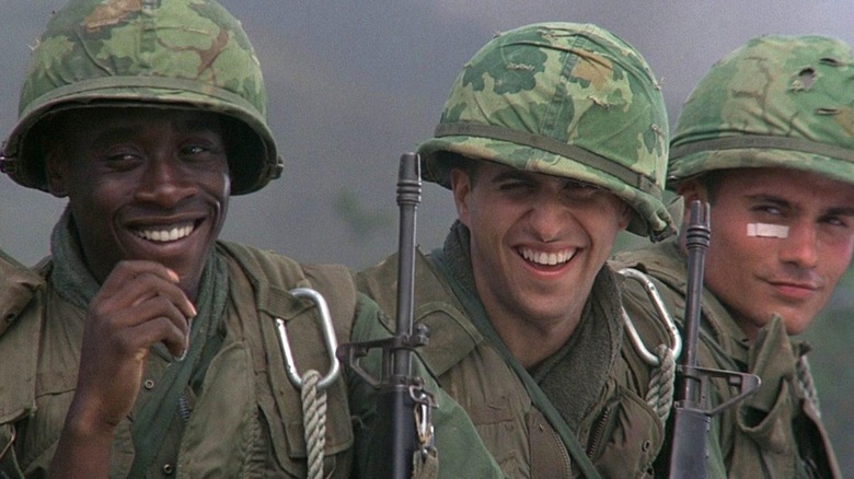 Don Cheadle as Washburn laughing alongside his fellow soldiers in Hamburger HIll