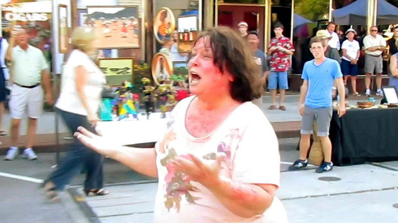 An infected woman runs through the street in The Bay (2012)