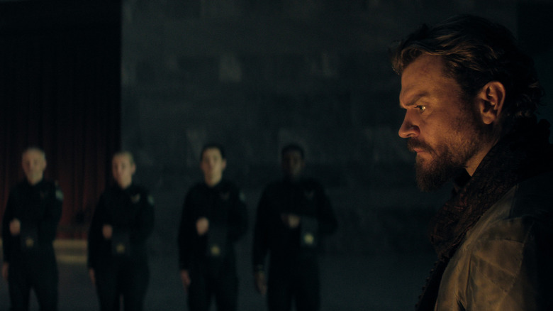 Pilou Asbæk as The Mule standing in front of several servants in Foundation season 3