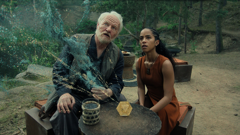 Jared Harris as an aged Hari Seldon and Lou Llobell as Gaal Dornick looking in wonder at an image projected from the prime radiant in Foundation season 3