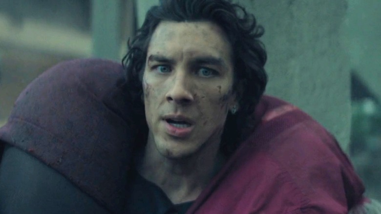 Toran carrying Bayta on his back while running from blaster fire in Foundation
