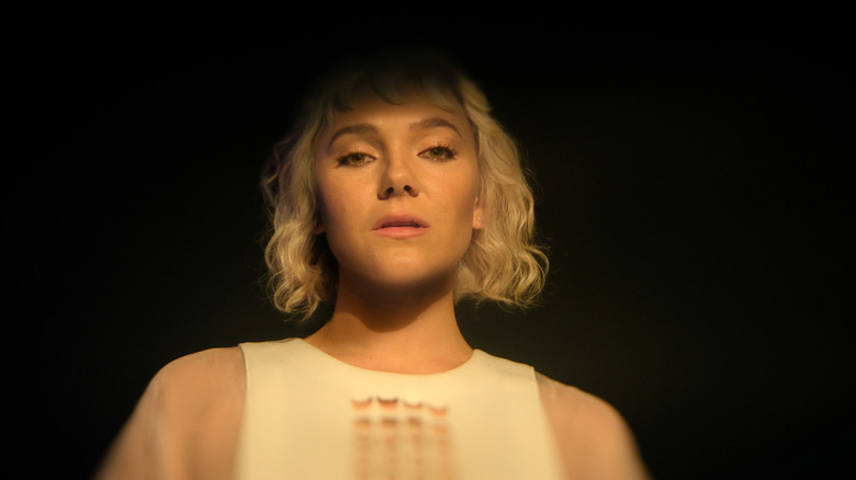 Synnøve Karlsen as Bayta emerging from the shadows in Foundation season 3