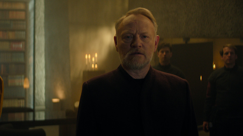 Harry Sildon addresses his followers inside a cellar in the institution