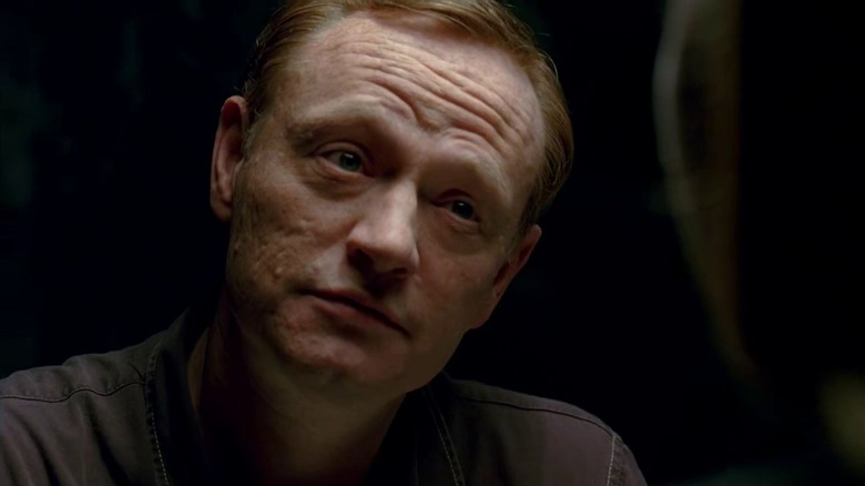 Jared Harris as David Robert Jones listening intently in Fringe