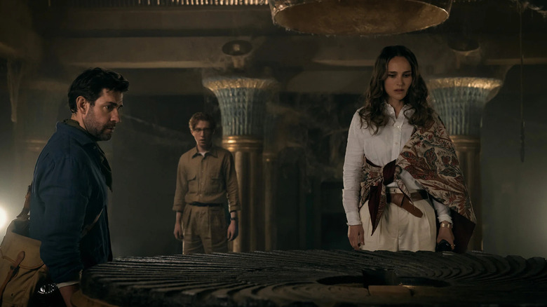 Luke, Owen, and Charlotte in front of a stone portal in Fountain of Youth.