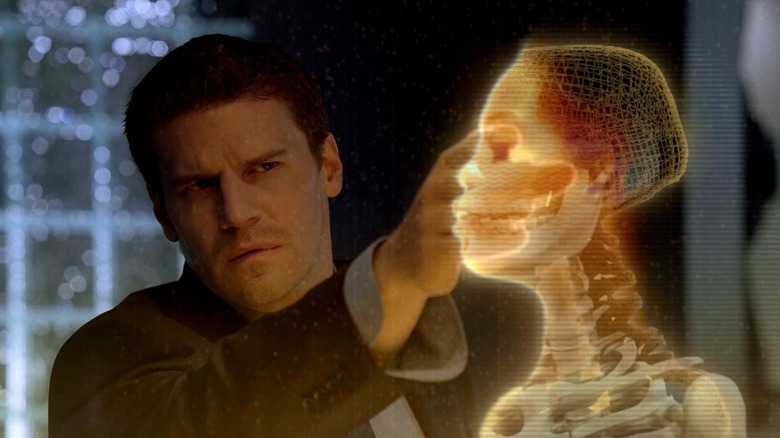 Booth feeling a holographic skeleton on Bones