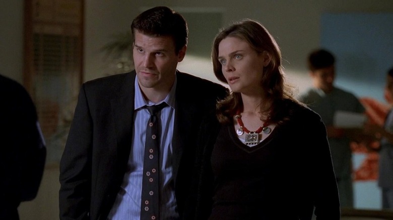 Bones and Booth talking to a man in a suit on Bones