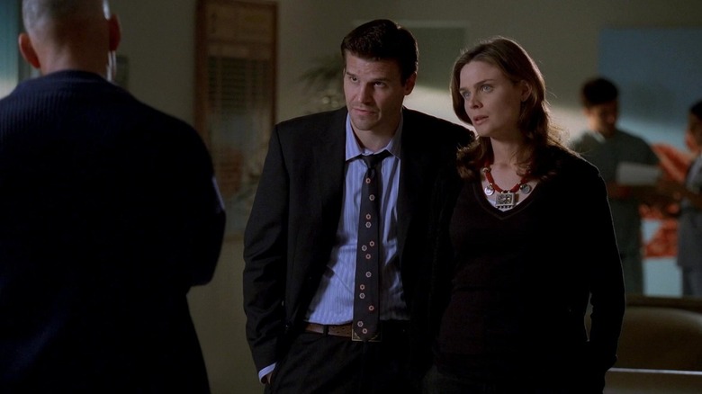 Bones and Booth talking to a man in a suit on Bones