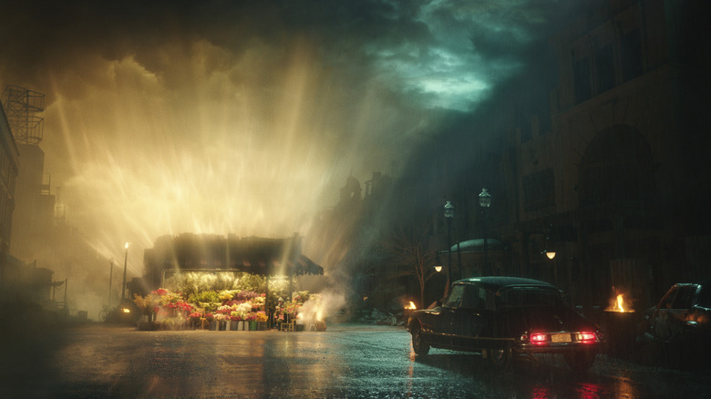 A car parked before a glowing, golden flower stand in Megalopolis