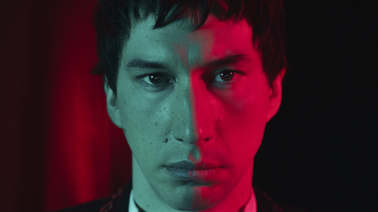 Cesar Catilina lit by red and blue light in Megalopolis