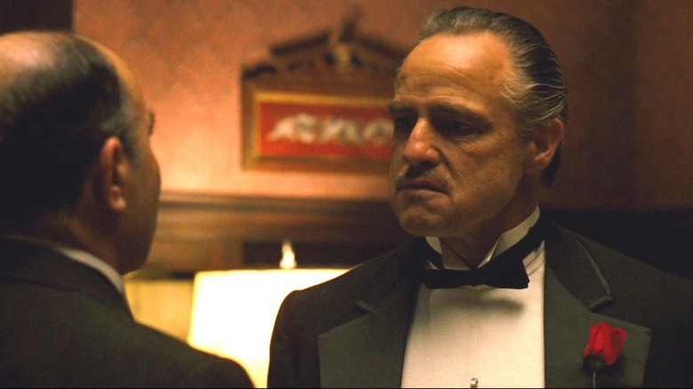 Vito Corleone standing face to face with someone in The Godfather