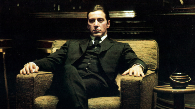Al Pacino seated as Michael Corleone in The Godfather