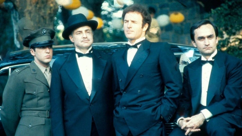 Marlon Brando's Don Corleone with his three sons in The Godfather