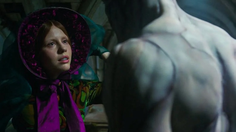 Frankenstein (2025) - Elizabeth sitting with The Creature