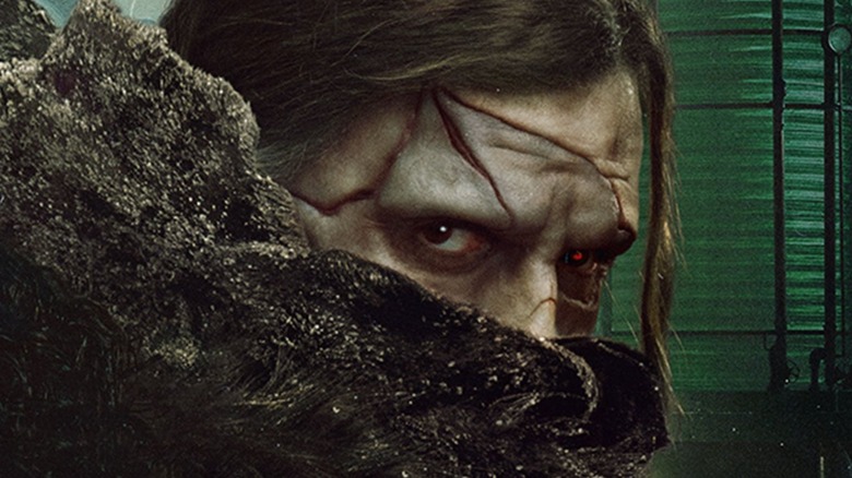 Cropped poster for Frankenstein (2025) showing the Creature's masked face and eyes