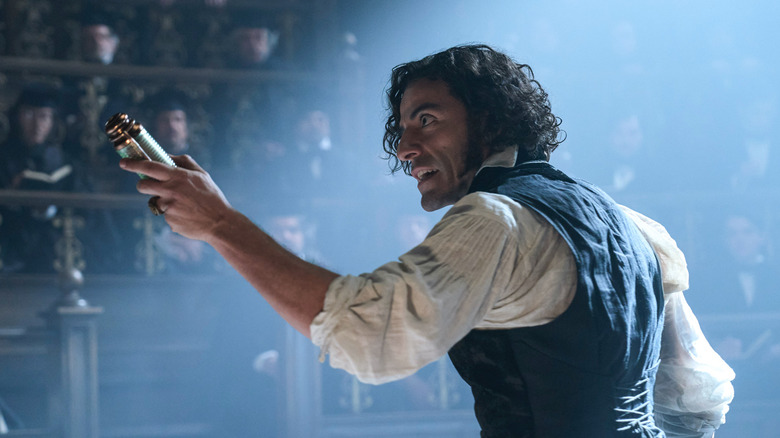 Victor Frankenstein talks to a room full of medical students in Frankenstein