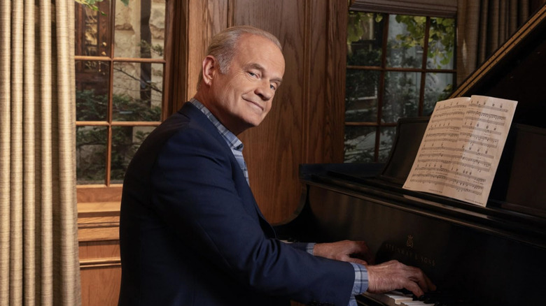 Kelsey Grammer's Frasier Crane sits at the piano in Frasier