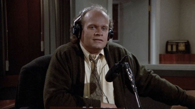 Kelsey Grammer's Frasier Crane hosts his talk radio show from behind a microphone on Frasier
