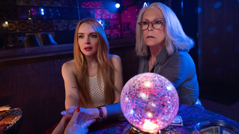 Anna (Lindsay Lohan) and Tess (Jamie Lee Curtis) get their fortunes read in Freakier Friday