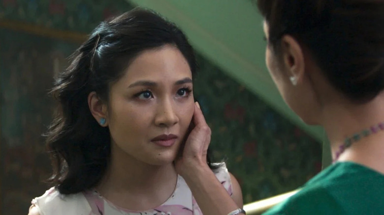 Constance Wu as Rachel Chu looks at Michelle Yeoh as Eleanor Sung-Young in Crazy Rich Asians.