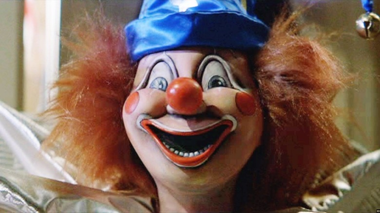 The clown gets Robbie in Poltergeist (1982)