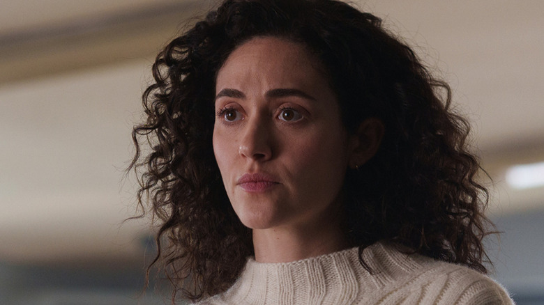 Alice in a cream sweater looking serious on Furious