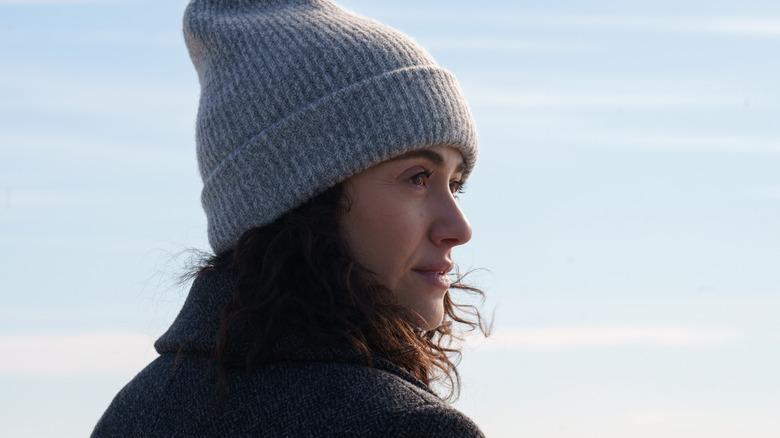 Alice in a winter hat looking over her shoulder on Furious