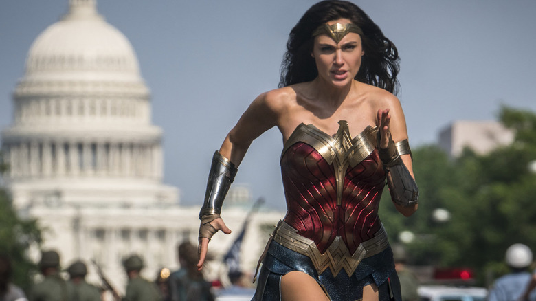 Gal Gadot as Wonder Woman running downt he street in Wonder Woman 1984