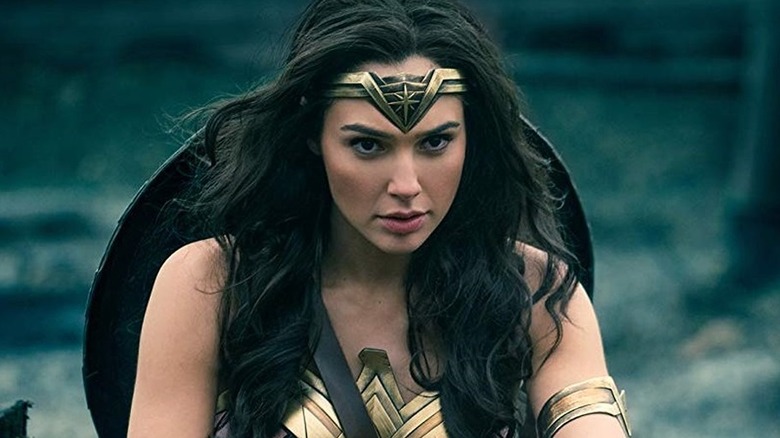 Gal Gadot as Wonder Woman climbing out of the trenches in Wonder Woman