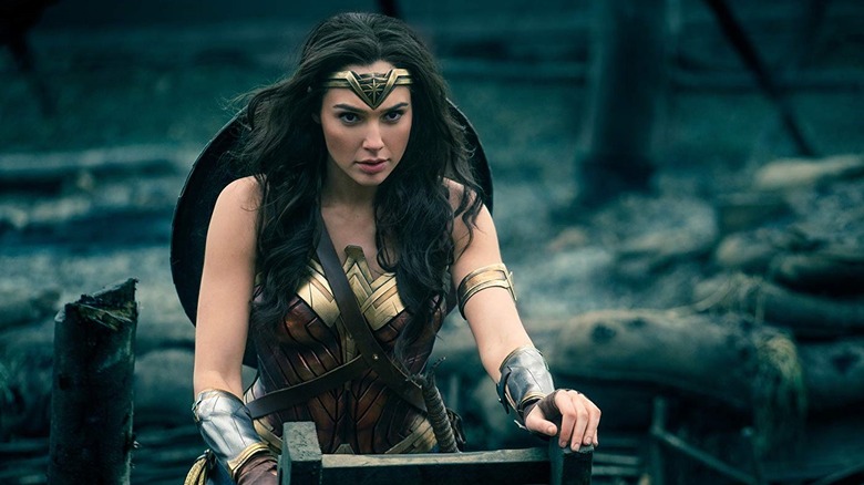 Gal Gadot as Wonder Woman climbing out of the trenches in Wonder Woman