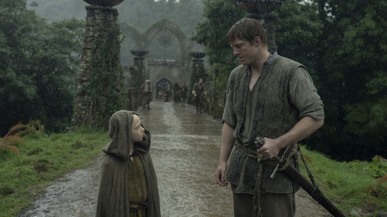 Egg and Dunk on a road looking at each other on A Knight of the Seven Kingdoms