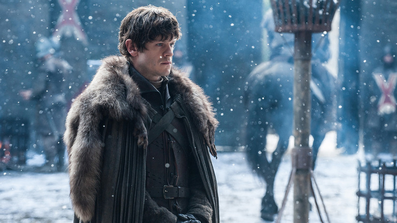 Ramsay standing in the snow at Winterfell on Game of Thrones
